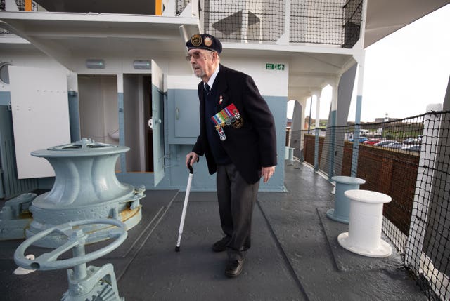 Veteran Wally Beall walks around the craft