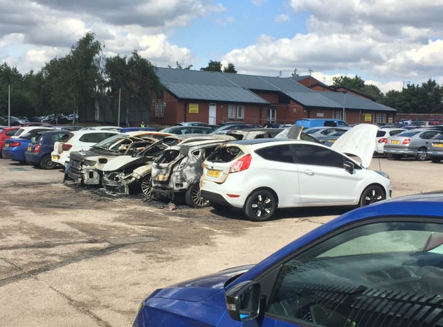 Burned out vehicles in the car park of HMP Birmingham