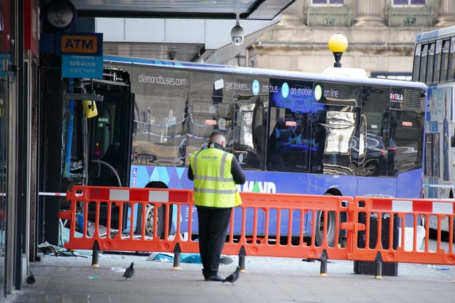 Emergency services at the scene of a bus crash at the City Tower building close to Manchester’s Piccadilly Gardens Metrolink stop