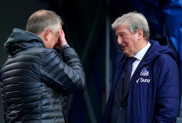 Chris Wilder, left, is consoled by Roy Hodgson after his side's 15th Premier League defeat of the season at Crystal Palace last Saturday