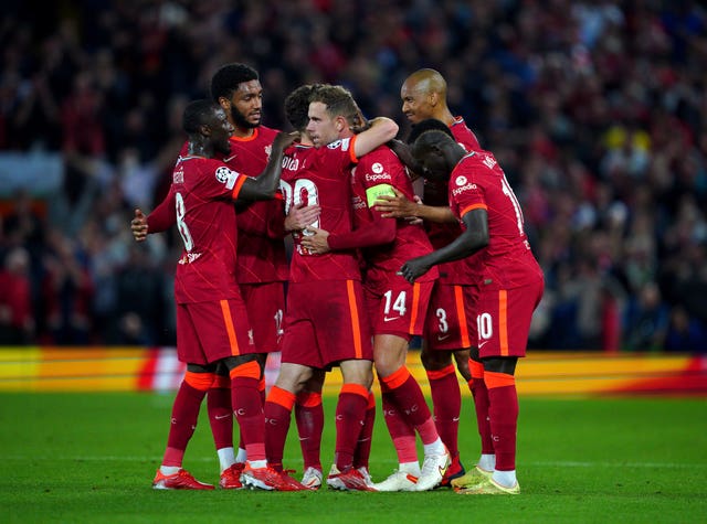 Liverpool players celebrate Jordan Henderson''s winner
