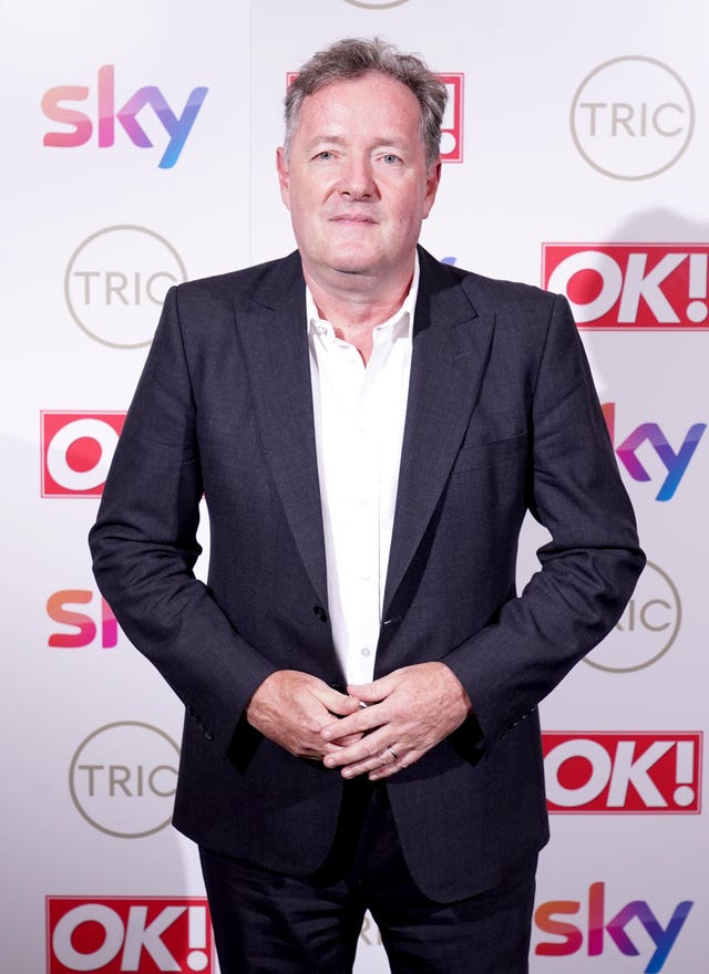 Piers Morgan posing for photos at a red carpet event