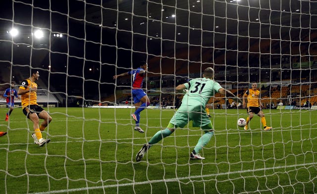 Daniel Podence, right, scores Wolves' second goal