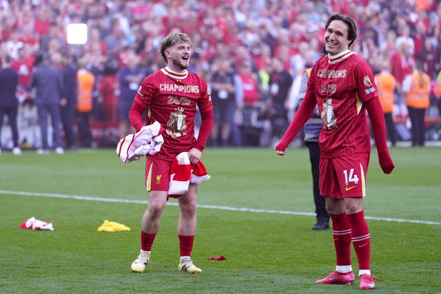Harvey Elliott, left, and Federico Chiesa celebrate Liverpool’s Premier League title