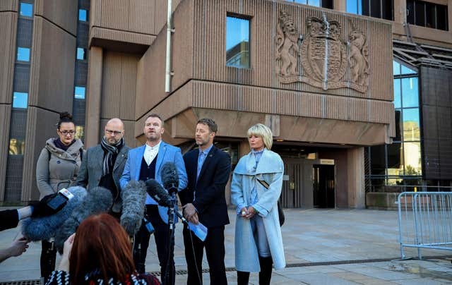 Chris Unsworth (second left), Micky Fallon (centre) and Steve Walters (second right), victims of Barry Bennell, speak to the media outside Liverpool Crown Court (Peter Byrne/PA)