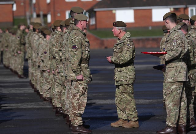 The Prince of Wales presents campaign medals.