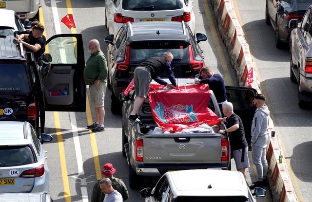 Liverpool supporters heading for the Champions League final in Paris wait amongst freight and holiday traffic queues at the Port of Dover in Kent (Gareth Fuller/PA)