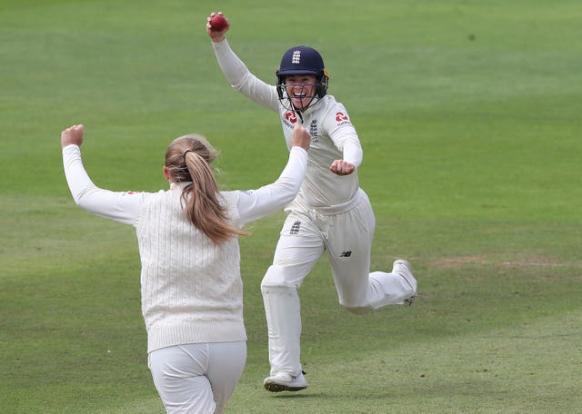 England's Tammy Beaumont celebrates taking the catch of Beth Mooney but Australia retained the Ashes
