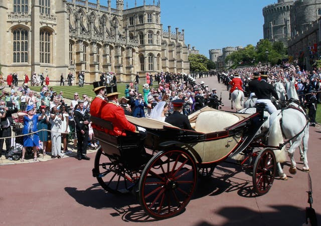 Meghan and Harry began their carriage ride by passing well-wishers in the grounds of Windsor Castle. (Chris Jackson/PA)