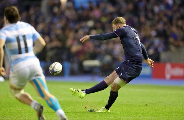 Finn Russell kicks a penalty
