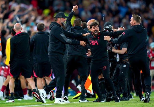 Liverpool's bench celebrate the late winner wildly