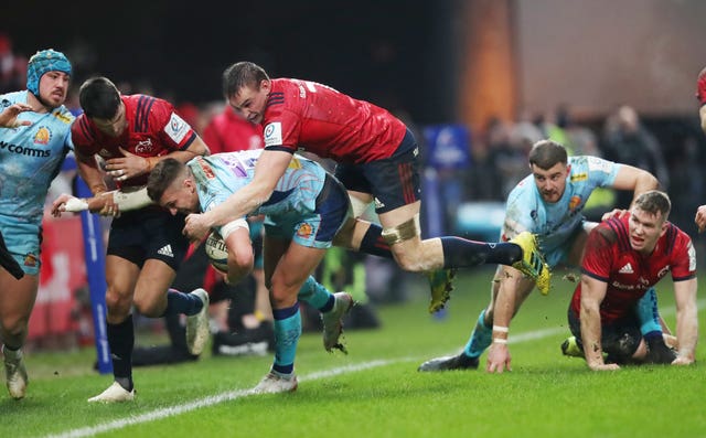 Exeter's Henry Slade is knocked into touch by Munster's Tommy O'Donnell (Niall Carson/PA).