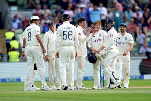 Dan Lawrence (centre) celebrates taking the wicket of New Zealand's Will Young