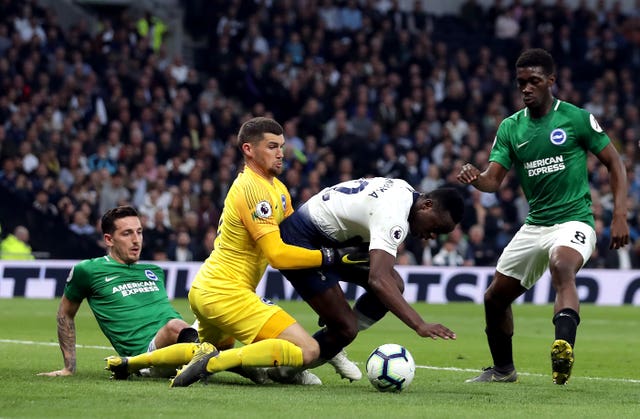 Victor Wanyama, centre, battles for possession with Brighton keeper Mat Ryan
