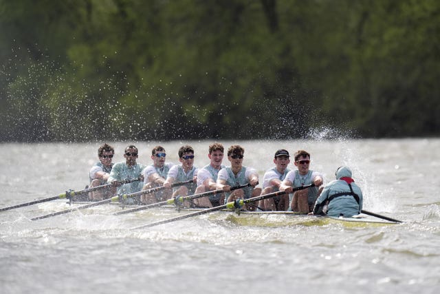 The Cambridge Men’s team compete during the Boat Race