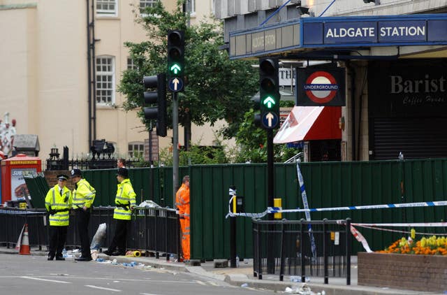 Police officers outside London’s Aldgate Underground station