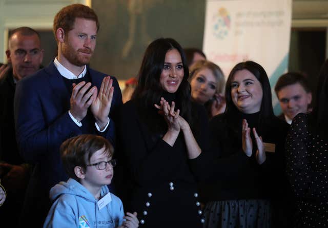 Prince Harry and Meghan Markle during a reception for young people at the Palace of Holyroodhouse in Edinburgh (Andrew Milligan/PA)