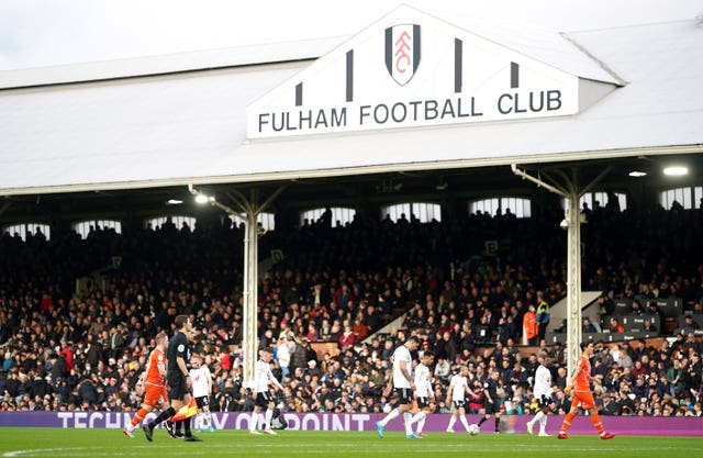 Fulham and Blackpool players leave the pitch
