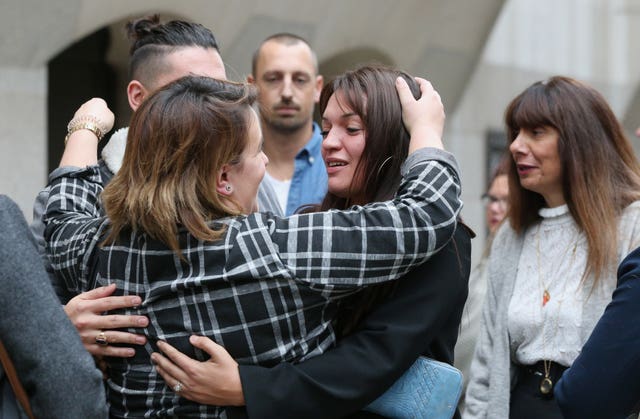 Samantha Collot (centre), a friend of Laureline Garcia-Bertaux, is comforted by friends outside the Old Bailey