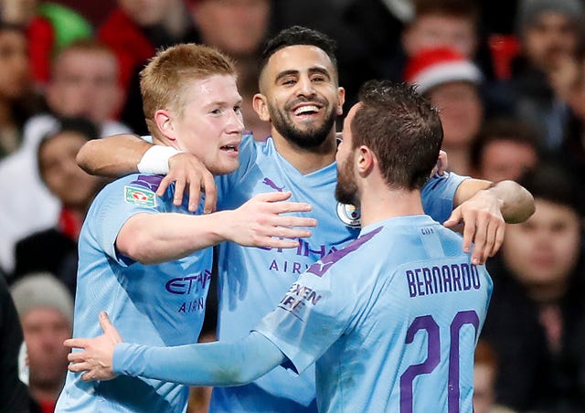 Riyad Mahrez (centre) celebrates scoring Manchester City's second goal in the first leg at Old Trafford last season.