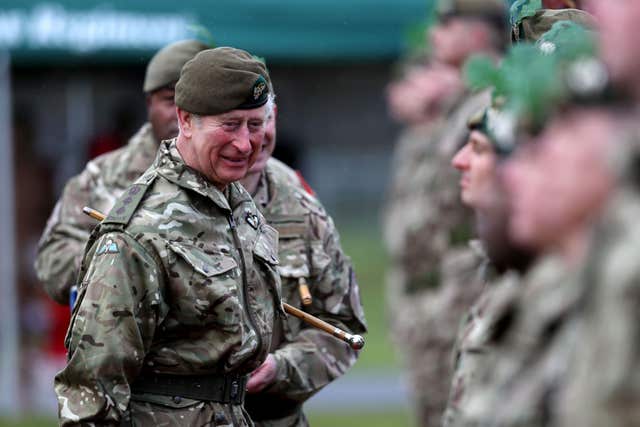 The Prince of Wales presents medals to troops from the Mercian Regiment during a visit to their Bulford Camp base in Wiltshire. (Peter Nicholls/PA)