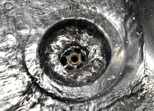 A general view of water dripping out of a kitchen tap