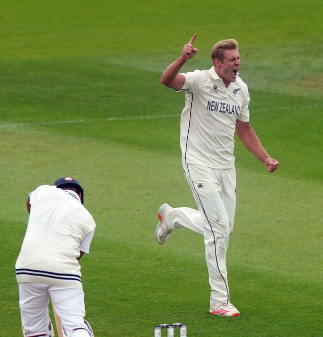 New Zealand's Kyle Jamieson celebrates the wicket of Rohit Sharma
