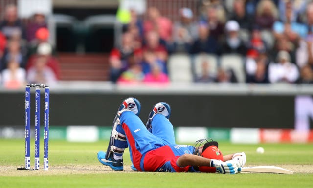 Hashmatullah Shahidi lies on the ground at Old Trafford 