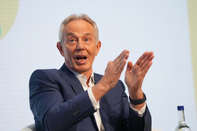 Sir Tony Blair gesturing with his hands