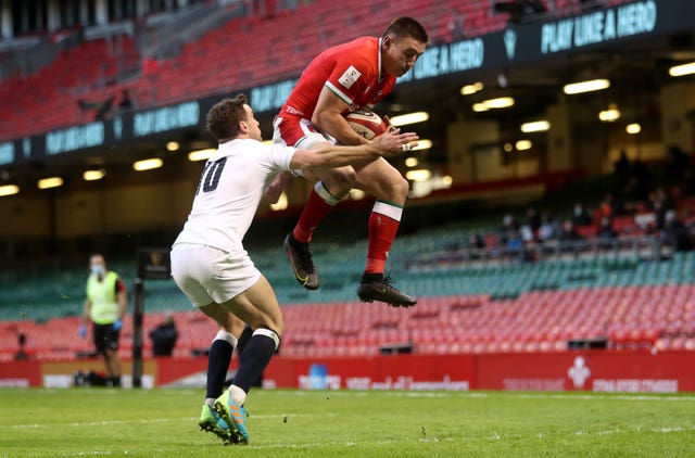 Josh Adams leaps high to catch Dan Biggar's kick for Wales' disputed first try