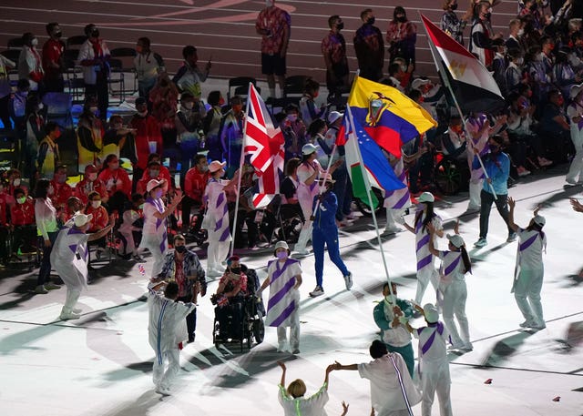 David Smith carries the union flag into the stadium