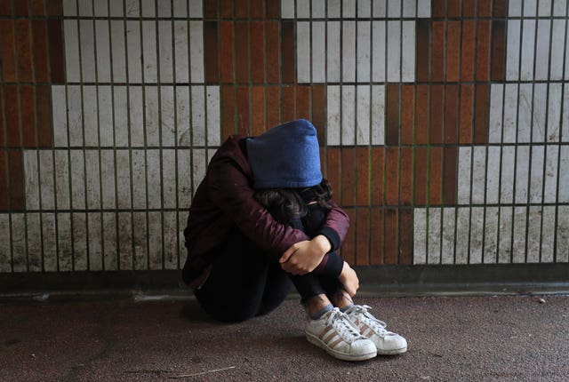 A picture posed by a model of a child in distress