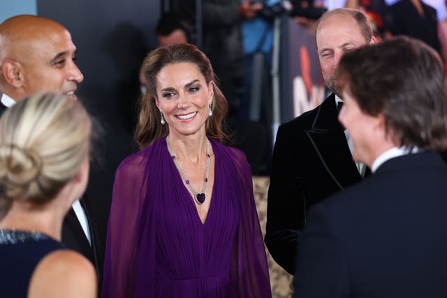 The Prince and Princess of Wales speaking to Tom Cruise