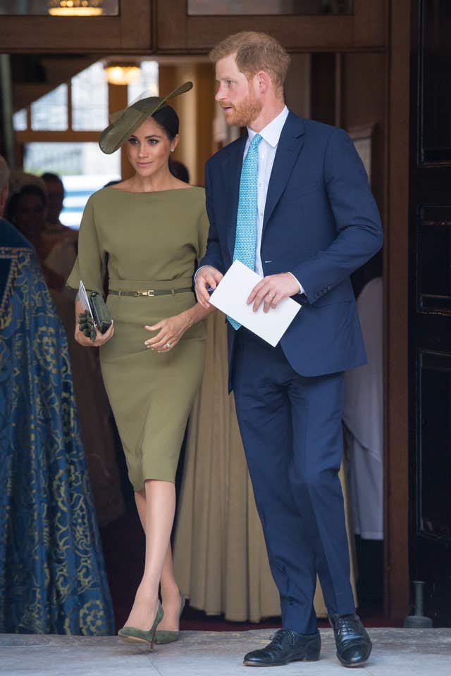 The Duke and Duchess of Sussex depart after attending the christening of Prince Louis at the Chapel Royal, St James’s Palace, London.