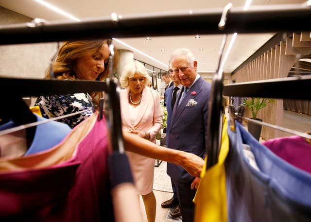 Charles and Camilla talk to British Fashion Council chief executive Caroline Rush (Henry Nicholls/PA)