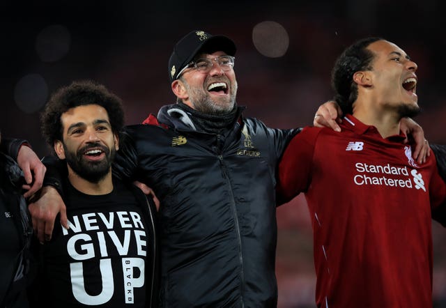 Mohamed Salah, left, was forced to sit out the match 