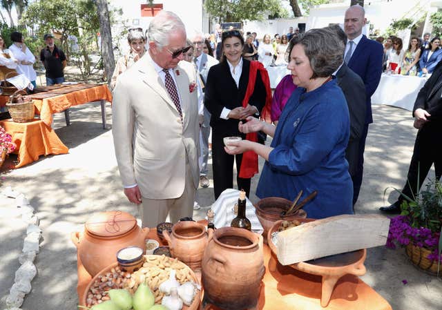 Charles, in his role as Patron of the British School at Athens, meets people taking part in a Cooking Like Minoans event at the Knossos Archaeological Site on the island of Crete (Chris Jackson/PA)