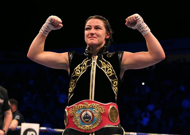 Katie Taylor celebrated becoming a two-weight world champion with victory against Christina Lindardatou in their WBO super-lightweight title bout in Manchester on Saturday night