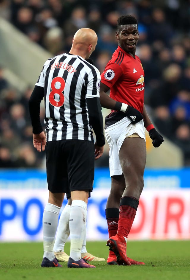 Manchester United's Paul Pogba exchanges words with Newcastle's Jonjo Shelvey