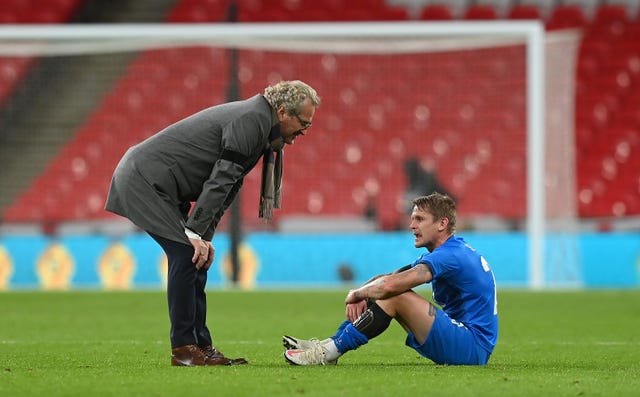 Iceland manager Erik Hamren speaks to Ari Skulason after full-time 