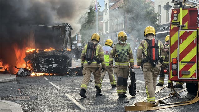 Emergency services attend to a bus fire