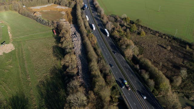 A general view of the 150m long mountain of rubbish that has been illegally dumped beside the A34 and near the River Cherwell in Kidlington, Oxfordshire