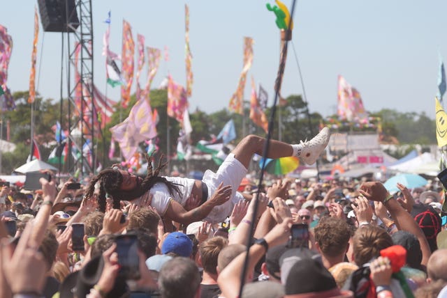 A member of punk dup Bob Vylan crowd-surfs at the West Holts Stage