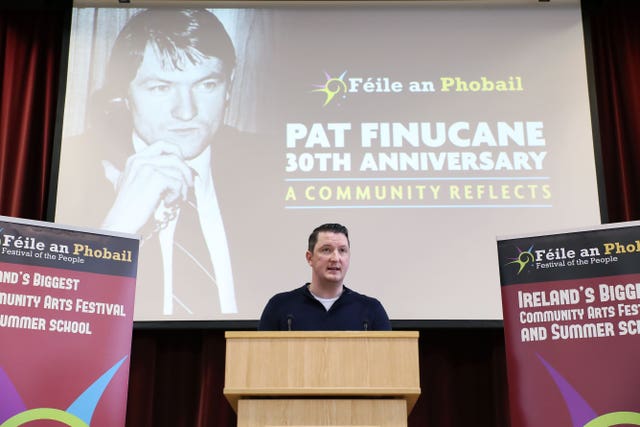 John Finucane speaking at St Mary's University College Belfast at an event to mark the 30th anniversary of the death of his father, Belfast solicitor Pat Finucane (Kelvin Boyes/AP)