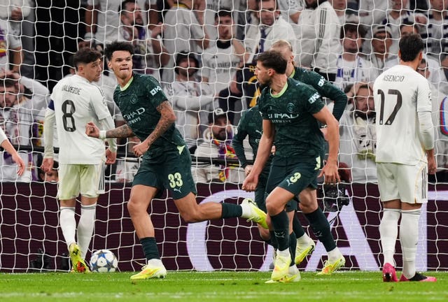 Manchester City’s Nico O’Reilly, left, celebrates his equaliser against Real Madrid