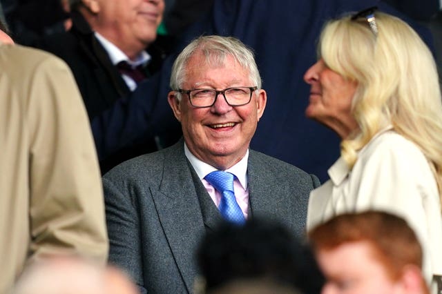 A smiling Sir Alex Ferguson in the stands during a game