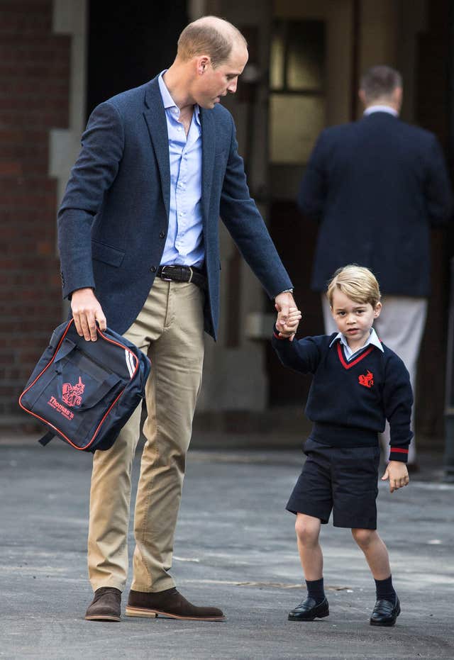 Prince George arrives with the Duke of Cambridge at Thomas’s Battersea in London, as he starts his first day of school (Richard Pohle/The Times/PA)