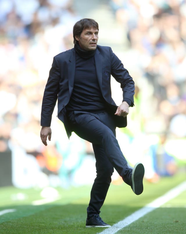 Antonio Conte kicks on the touchline