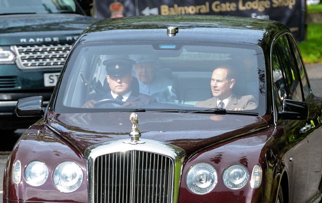 Prince Andrew sits next to chauffeur