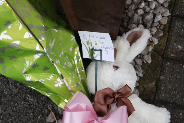 Tributes left at the scene on Saturday (Danny Lawson/PA)